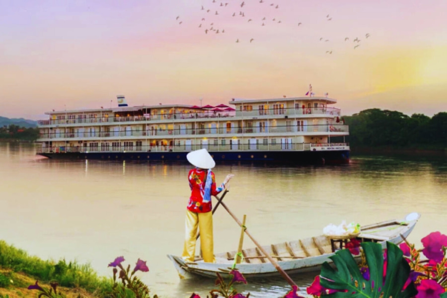 Mekong River Cruise sailing at sunset with local woman on boat by Auasia Travel